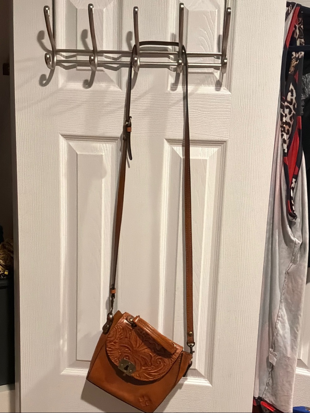 Tan Leather Crossbody Bag with Embossed Floral Flap